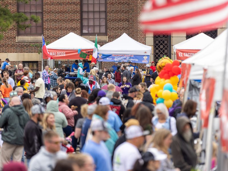 A large crowd of people attending Taco Wars.